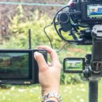 Zhiyun Weebill 2 Pro Kit which shows a person pointing a camera at another stand camera