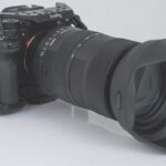 A black professional camera with a large lens