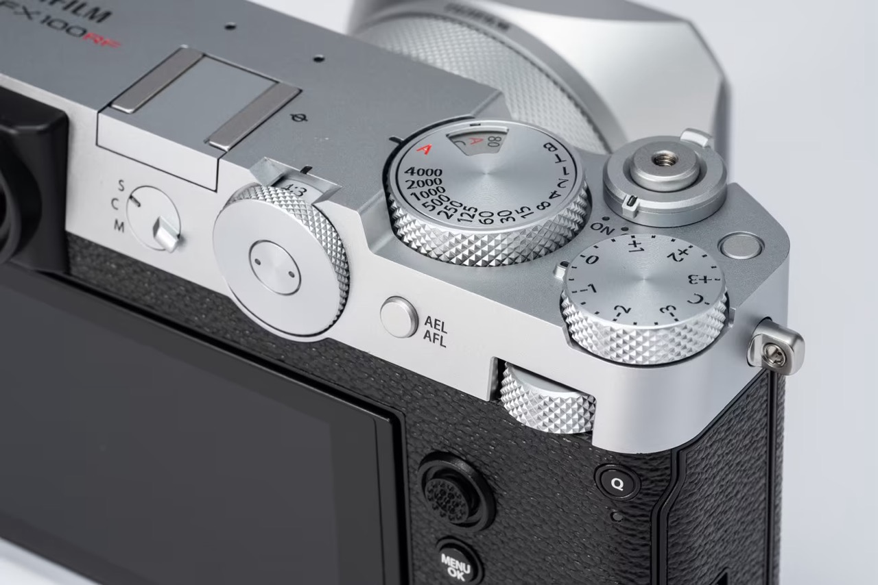 Close-up of the corner of a Fujifilm GFX100RF camera showing numerous buttons