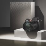 A Leica SL3-S mirrorless camera sitting on a podium