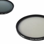 Two round Tiffen filters laying diagonally from each other