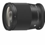 A black camera lens with a textured middle