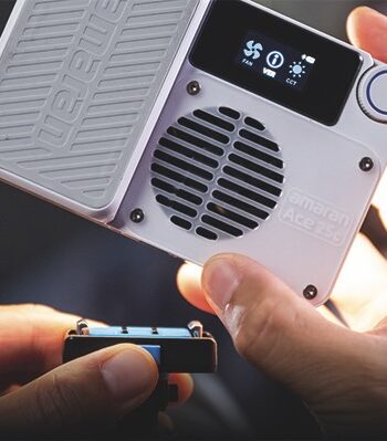 A small handheld light which fits into a large white device