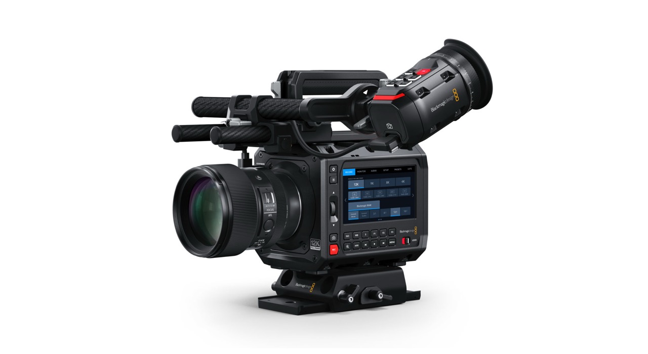 A large cinema camera with multiple attachments