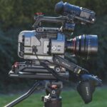 A high-tech camera standing on a tripod outside