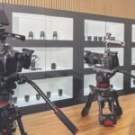 CVP camera showroom with profession cameras on a table and lenses in a case behind