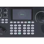 Top view of a remote controller wot numerous ports and buttons