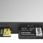 A silver SD card reader with different sized cards inserted in the front