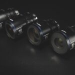 A row of lenses with a blue trim against a black background