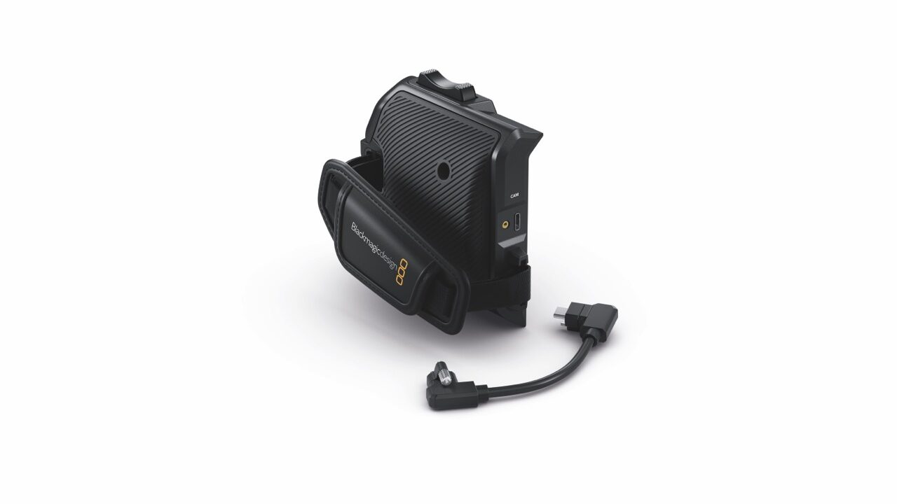 A camera grip and a wire against a white background
