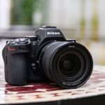 A Nikon Z5II sitting on a patterned table
