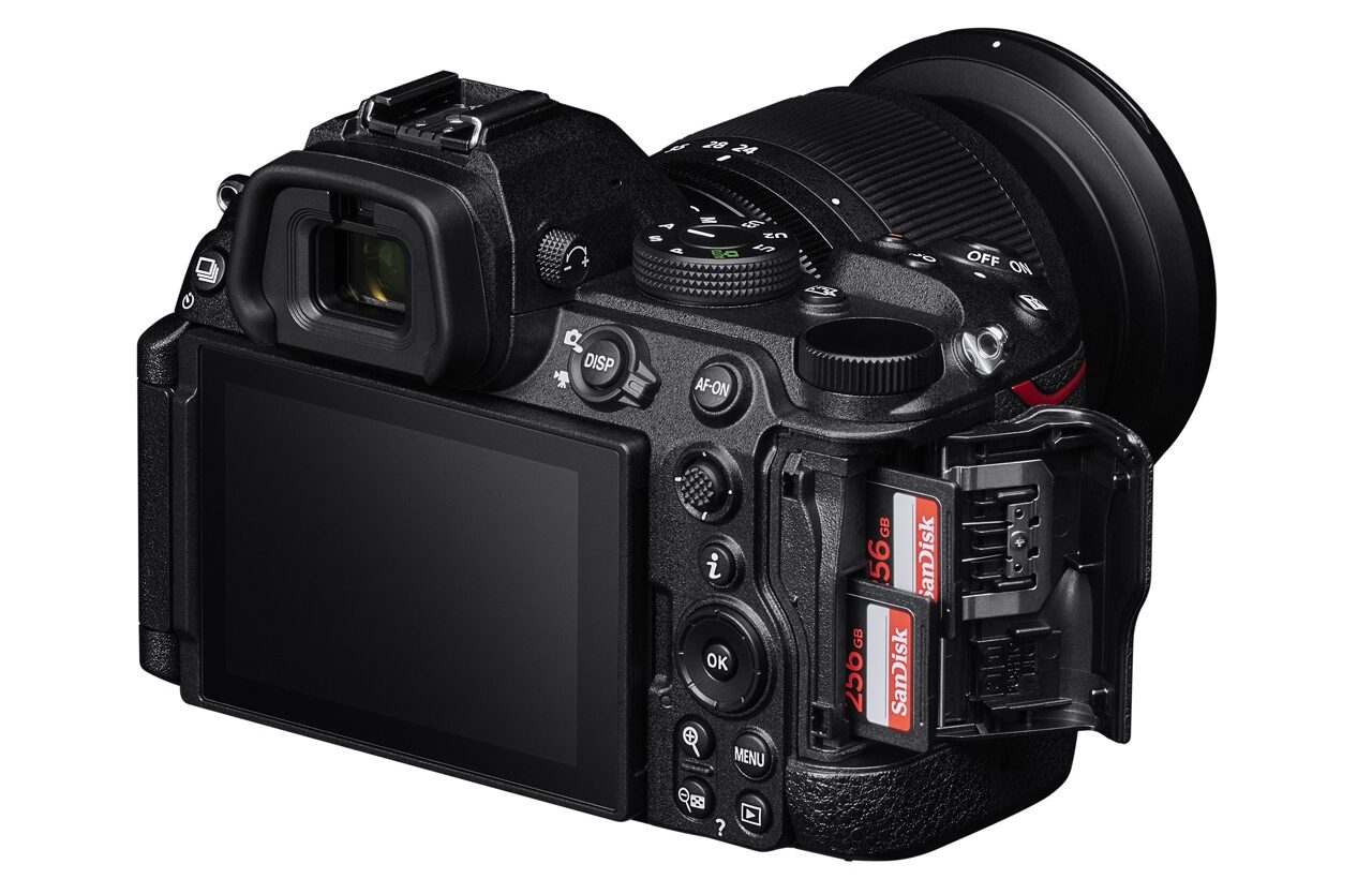 The back of a Nikon Z5II camera with the side slots open to show the cards. It has a display screen on the back