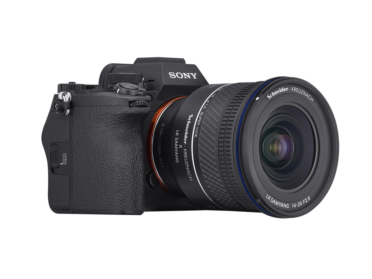 A black camera with a large lens sitting at a diagonal against a white background