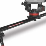 A camera on a sliding mount made of black and red metal