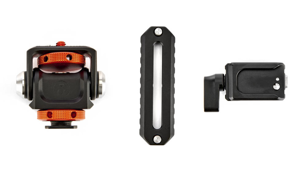Three tripod accessories lined in a row against a white background