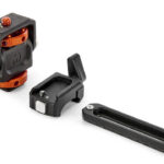 Three tripod accessories lined in a diagonal row against a white background