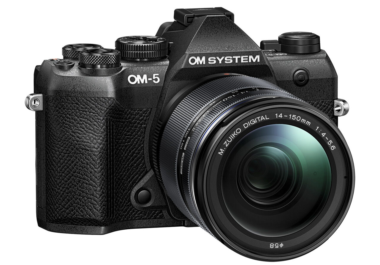 A black camera from OM System with a lens attached
