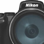 A black rounded Nikon camera with a large circular lens