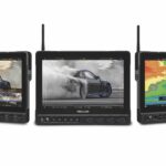 A line of monitors showing a photo of a car in different colours. An antenna extends from the top