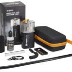 A group of equipment from Kenro laid on a table, including a small fog machine and a case