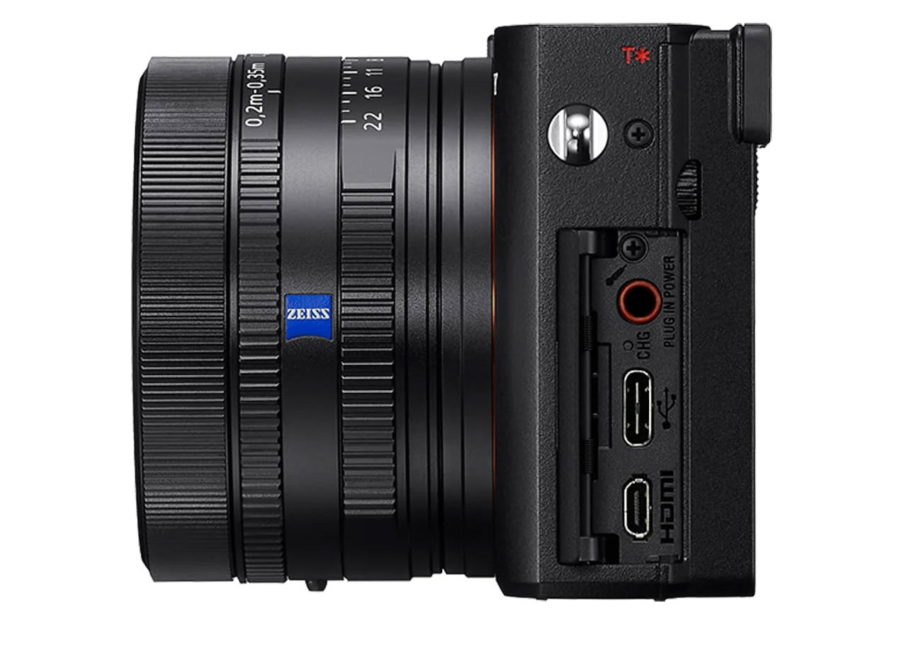 Side view of black Sony RX1R III lens with blue light in the middle and multiple ports