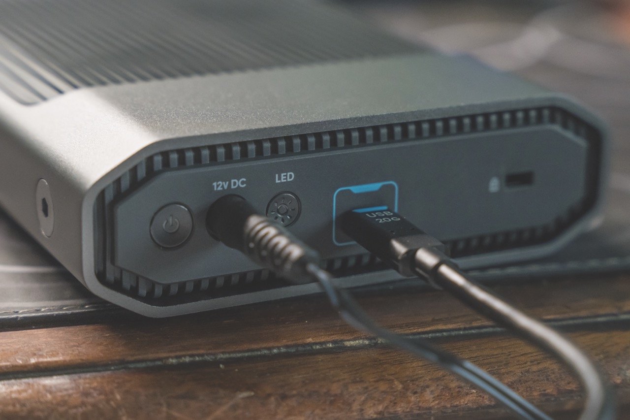 The back of a storage device with wires attached