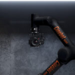 A mechanical robot arm from MRMC sitting in a dark room