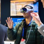 A man wearing a VR headset at the IBC conference