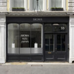 The front of a black storefront for Sigma
