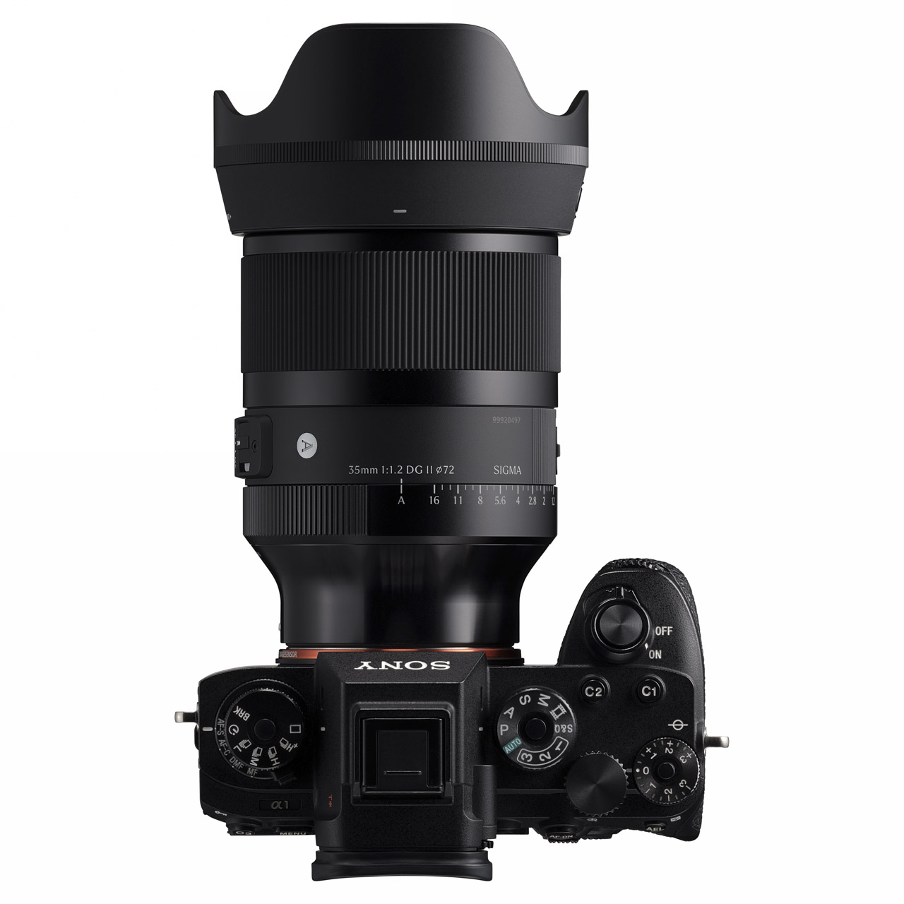 Top view of a camera with large Sigma lens attached, against a white background