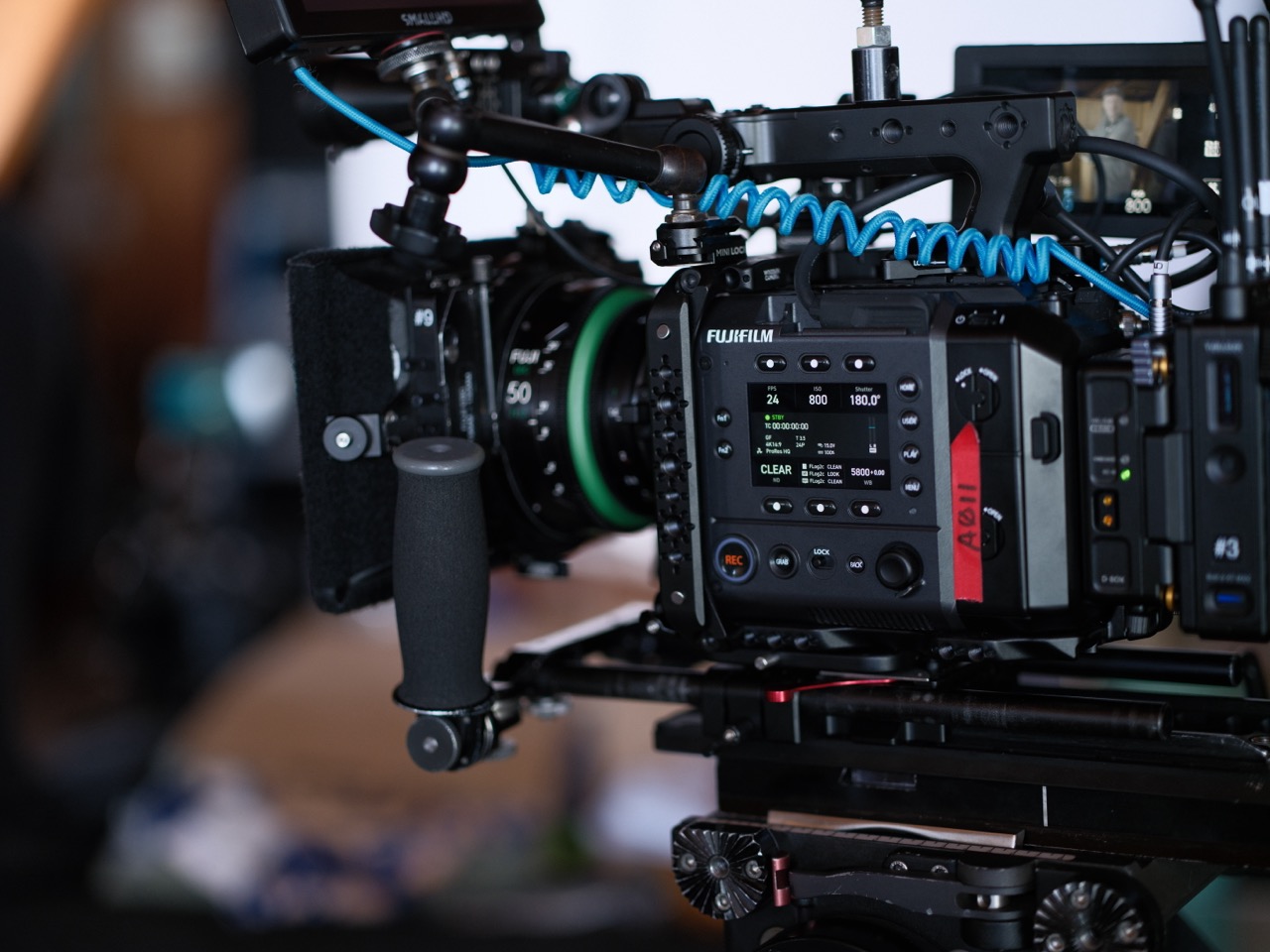 The side of a professional film camera from Fujifilm, with a blurred background
