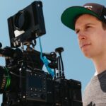 A man operating a professional film camera by Fujifilm