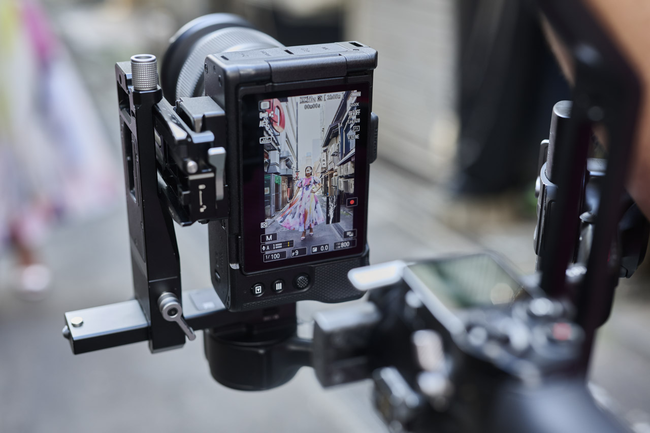 Someone using a Nikon camera vertically while mounted to a rig