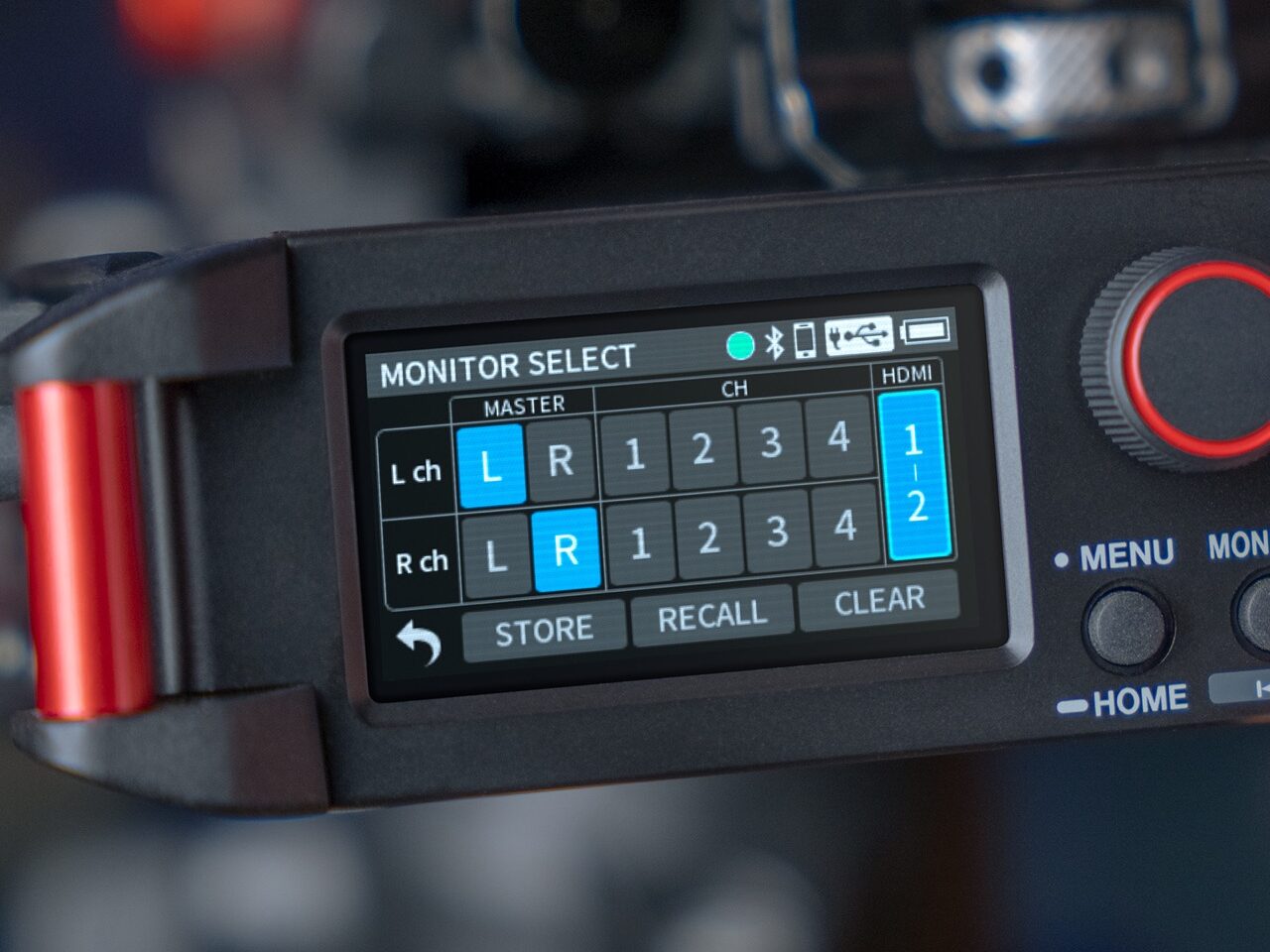 The screen of a recording device from Tascam with numbers on it and blue squares
