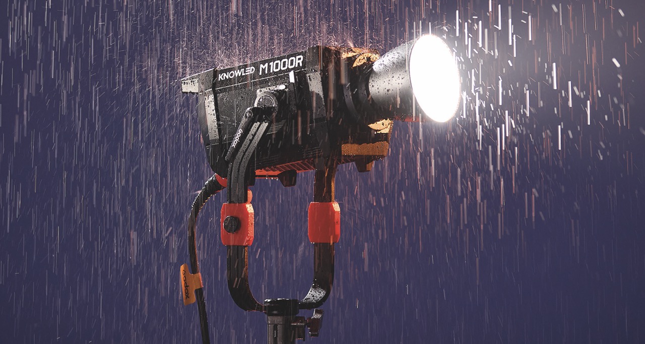 A professional light from Astera with rain illuminated by the bulb