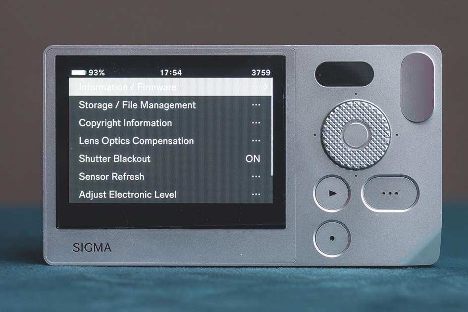 With few buttons, the menu is the only way to navigate. Who cares when the camera looks so cool? A simple screen from a Sigma BF showing different camera options, sitting on a blue surface