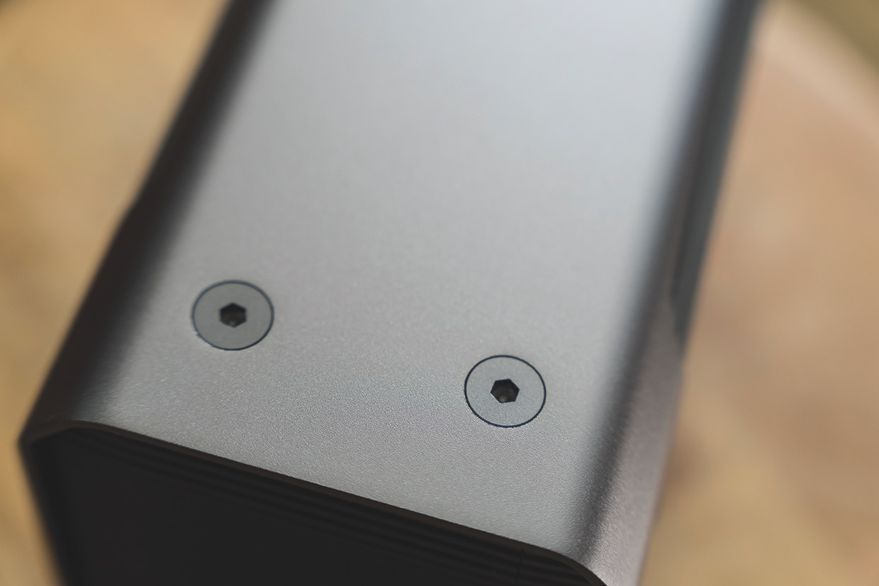 The metal enclosure is bolted together (left). The rear panel shows two Thunderbolt ports plus RAID settings (right) The bottom of a device from Western Digital showing the seamless bolts in the metal