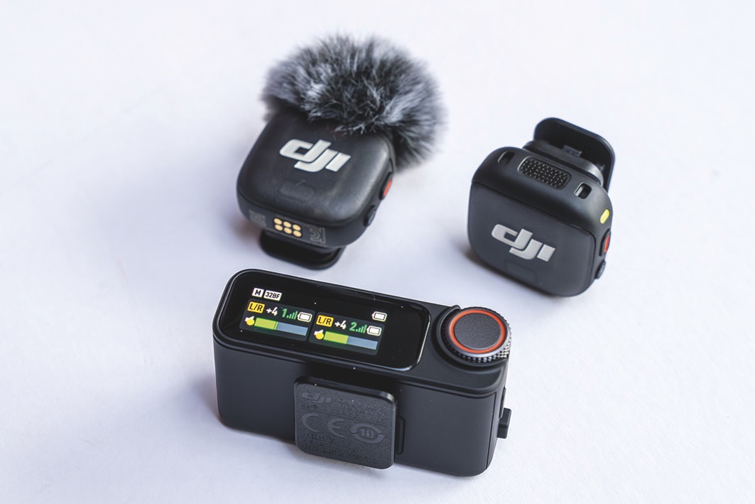 Three recording devices from DJI placed on a white table