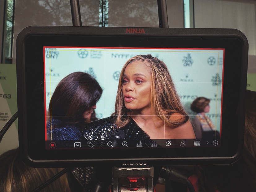 A camera monitor showing a celebrity on a red carpet