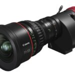 A long lens from Canon with a red end, against a white background