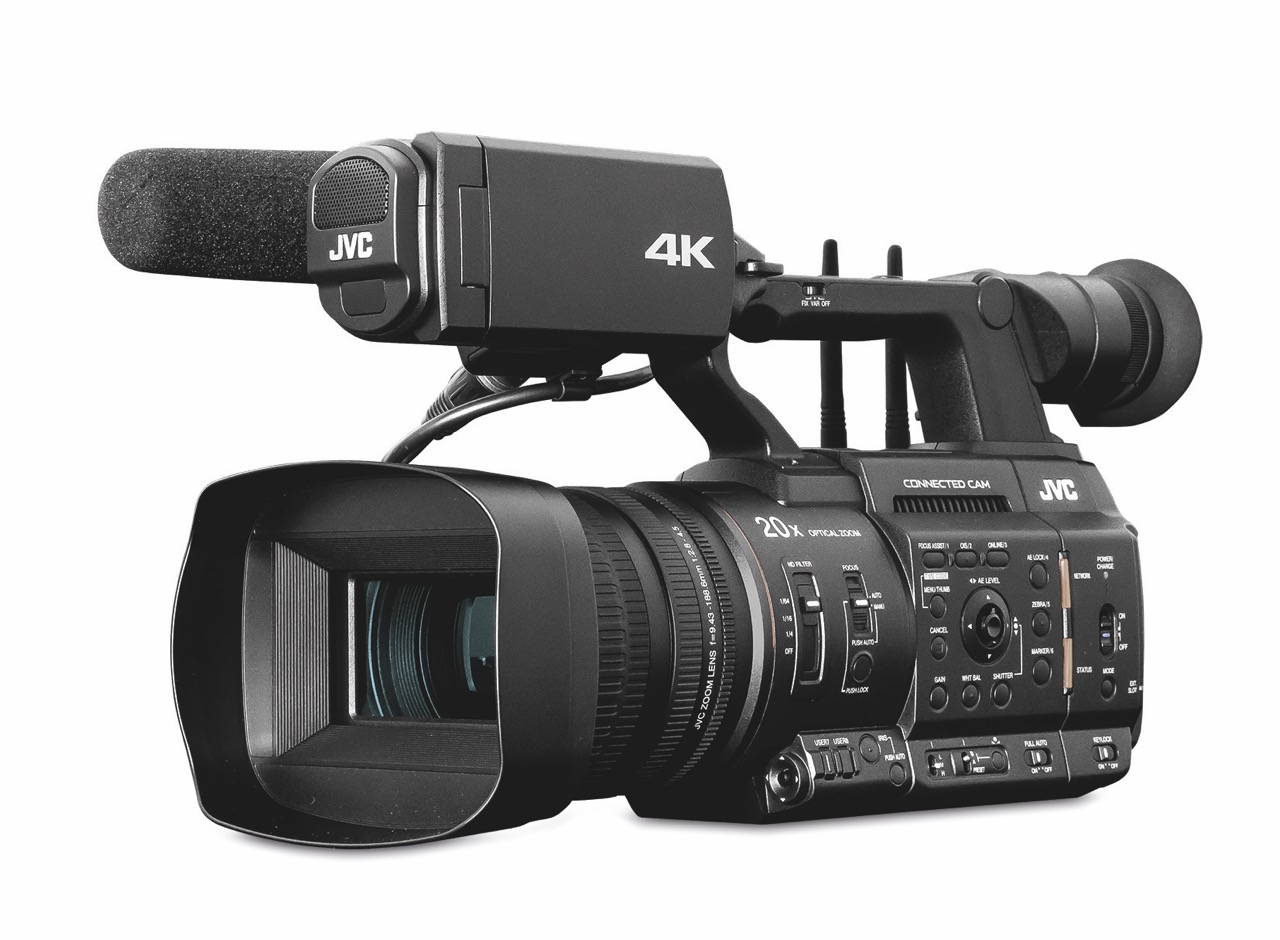 A camcorder from JVC with a large microphone attached to the top, against a white background