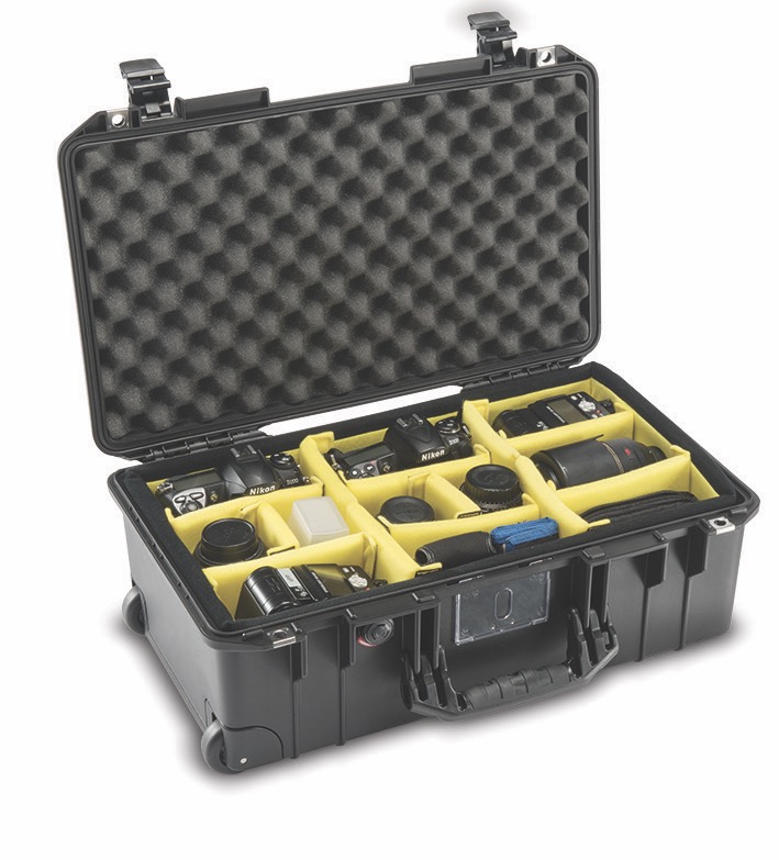 A black case from Peli with a yellow interior casing and mesh to keep camera equipment safe