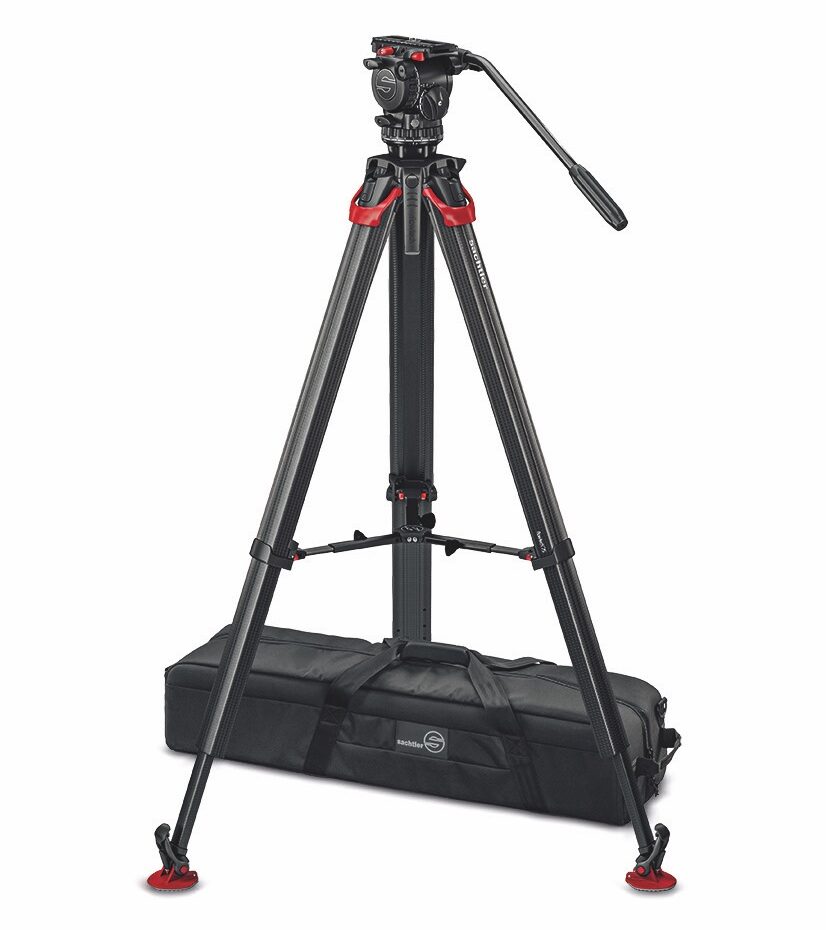 A tripod from Sachtler Flowtech with a case under the legs. The tripod has a Aktiv8t head attached, against a white background