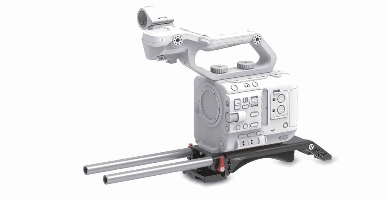 A white camera on a rig by Vocas, against a white background