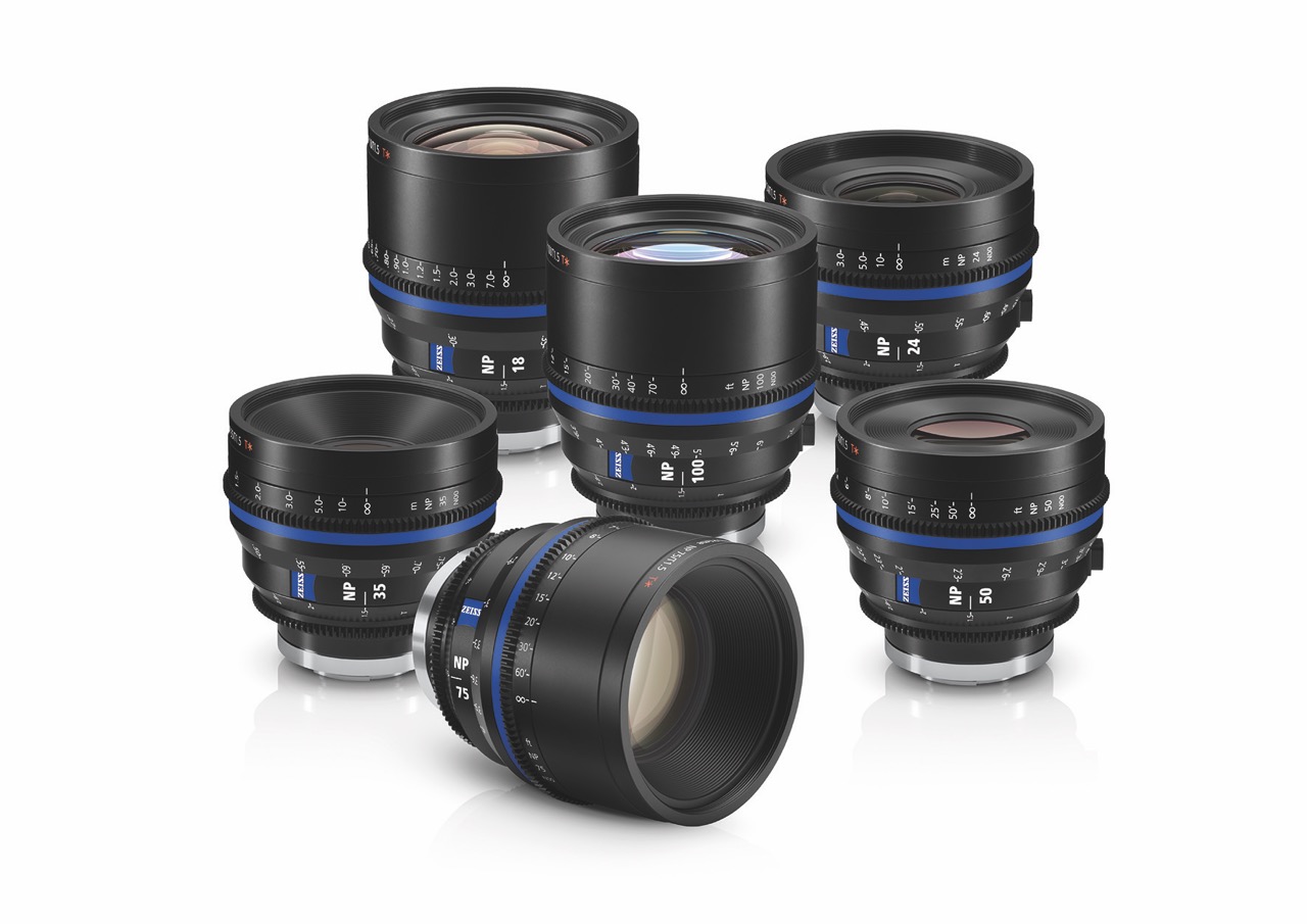 A collection of six Zeiss lenses with black body and blue features, against a white background