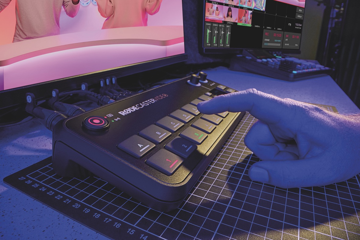 Rodecaster Video. Image: Rode A mixing board from Rode attached to a computer in blue lighting