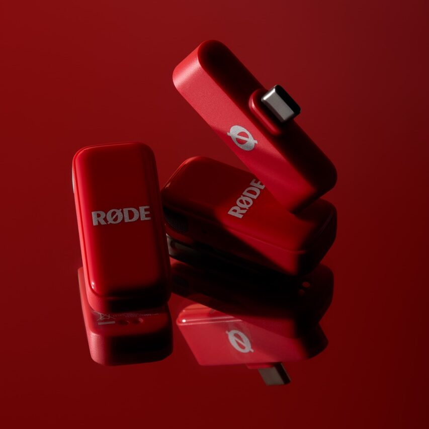 A collection of red microphones from Rode, against a red background