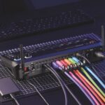 A device from Rode with a rainbow of wires plugged into the back