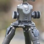 Camera with a large lens attached to a tripod