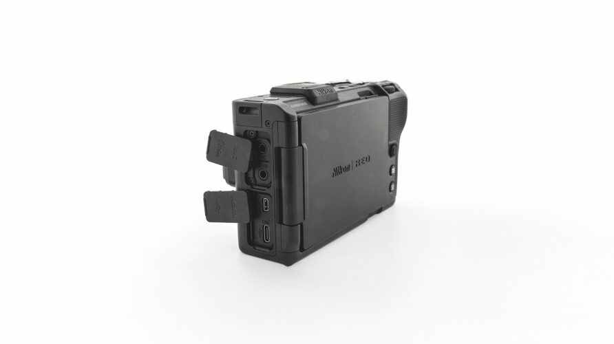 A black Nikon box with lots of ports and jacks, against a white background